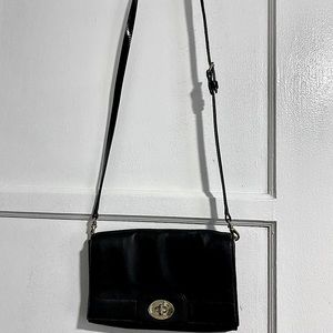 Kate Spade Black Sling Leather bag/Crossbody bag. The strap is adjustable.